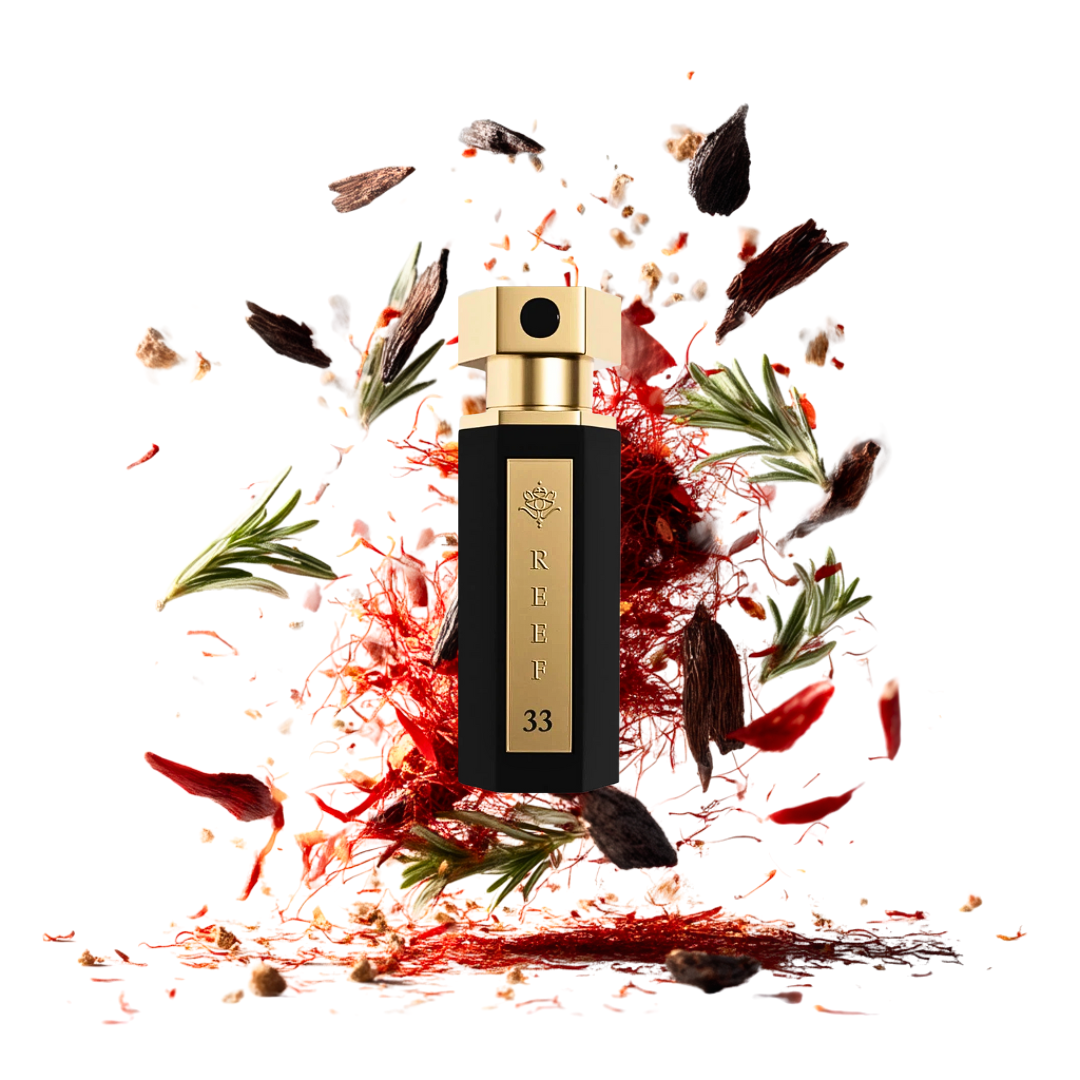Reef33 15ml –schwarzes Flakon umgeben von Safran, Rosmarin und Oudholz